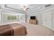 Large main bedroom with tray ceilings, many windows and sitting area at 127 Sanctuary Ave, Woodstock, GA 30188