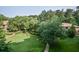Beautiful aerial view of the manicured green space, mature trees, and walkways in this community at 1800 Clairmont Lk # 413, Decatur, GA 30033