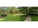Manicured complex green grounds with mature shade trees and sidewalks at 1800 Clairmont Lk # 413, Decatur, GA 30033