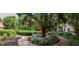 Well maintained complex grounds with landscaping, mature trees, and sidewalk at 1800 Clairmont Lk # 413, Decatur, GA 30033