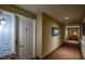 Well-lit hallway with neutral tones provides a welcoming entrance to individual units at 1800 Clairmont Lk # 413, Decatur, GA 30033