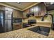 Updated kitchen featuring stainless steel appliances, granite countertops, and modern fixtures at 1800 Clairmont Lk # 413, Decatur, GA 30033