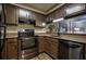 Well-appointed kitchen featuring stainless steel appliances, granite countertops, and sleek black accents at 1800 Clairmont Lk # 413, Decatur, GA 30033