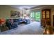 Spacious living room features a comfortable sofa, stylish decor, and large windows for natural light at 1800 Clairmont Lk # 413, Decatur, GA 30033