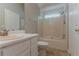 This standard bathroom features a shower-tub combo and single sink vanity at 3037 Botany Dr, Jonesboro, GA 30236