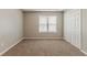 A bright bedroom includes a window for natural light and a large closet for storage at 3037 Botany Dr, Jonesboro, GA 30236