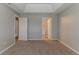 This spacious bedroom features neutral walls, carpet flooring, and a vaulted ceiling at 3037 Botany Dr, Jonesboro, GA 30236