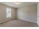 A spacious bedroom has a window for natural light and a closet for ample storage at 3037 Botany Dr, Jonesboro, GA 30236