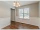 Clean dining area with hardwood floors, wainscoting, and natural light at 3037 Botany Dr, Jonesboro, GA 30236