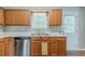 Well-lit kitchen features stainless steel appliances and ample cabinet space at 3037 Botany Dr, Jonesboro, GA 30236