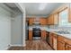 Functional kitchen with stainless steel appliances and light wood cabinets at 3037 Botany Dr, Jonesboro, GA 30236