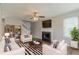 Cozy living room with fireplace, modern furnishings, and lots of natural light at 3037 Botany Dr, Jonesboro, GA 30236