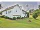 Manicured backyard showcasing a fire pit, mature landscaping, and lush green grass at 501 Grace Ct, Temple, GA 30179