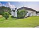 Well-maintained backyard featuring mature trees, lush green grass, and a tidy landscape at 501 Grace Ct, Temple, GA 30179