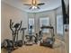 Spacious exercise room with treadmill, elliptical and television at 501 Grace Ct, Temple, GA 30179
