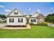 Beautiful home with fresh landscaping, white picket fence, and a manicured lawn at 501 Grace Ct, Temple, GA 30179