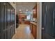 Spacious kitchen with wood cabinets, tile floor, and stainless steel appliances at 501 Grace Ct, Temple, GA 30179