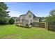 The backyard shows a deck, gazebo, and partial fencing in this exterior image at 1920 Lee Patrick Dr, Dacula, GA 30019
