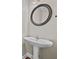 Powder room featuring a pedestal sink and oval mirror at 1920 Lee Patrick Dr, Dacula, GA 30019