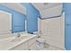 Clean bathroom featuring a tub/shower combination, modern vanity, and blue painted walls at 1920 Lee Patrick Dr, Dacula, GA 30019
