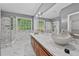 Bathroom with marble countertops, bowl sinks, and a separate glass-enclosed shower at 1920 Lee Patrick Dr, Dacula, GA 30019