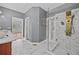 Luxurious bathroom featuring dual vessel sinks, marble countertops, and glass-enclosed shower at 1920 Lee Patrick Dr, Dacula, GA 30019