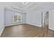 Comfortable bedroom featuring hardwood floors, large windows, and a trey ceiling at 1920 Lee Patrick Dr, Dacula, GA 30019