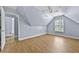 Cozy attic bedroom with hardwood floors, natural light and light blue walls at 1920 Lee Patrick Dr, Dacula, GA 30019
