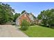 Well-manicured lawn and long driveway lead to this charming two-story brick home with attached garage at 1920 Lee Patrick Dr, Dacula, GA 30019