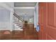 Inviting foyer with hardwood floors, staircase, and a glimpse into the spacious living area at 1920 Lee Patrick Dr, Dacula, GA 30019