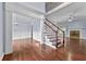 Elegant foyer boasts hardwood floors, staircase, and views into the dining and living areas at 1920 Lee Patrick Dr, Dacula, GA 30019