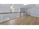 Spacious second floor hallway with wood floors and railing at 1920 Lee Patrick Dr, Dacula, GA 30019
