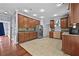 Open kitchen layout with wood cabinets, stainless steel appliances, and tile flooring at 1920 Lee Patrick Dr, Dacula, GA 30019