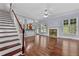 Spacious living room featuring hardwood floors, fireplace, and an open layout perfect for entertaining at 1920 Lee Patrick Dr, Dacula, GA 30019