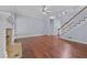 Large living room with hardwood floors, fireplace, and staircase, perfect for Gathering gatherings at 1920 Lee Patrick Dr, Dacula, GA 30019