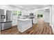 Stylish kitchen with stainless steel appliances, white cabinetry, and a functional center island at 2209 Browns Mill Se Rd, Atlanta, GA 30315