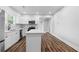 Modern kitchen featuring white cabinets, stainless steel appliances, and a central island at 2209 Browns Mill Se Rd, Atlanta, GA 30315