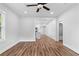 Open-concept living space with hardwood floors, modern lighting, and a seamless flow to other rooms at 2209 Browns Mill Se Rd, Atlanta, GA 30315
