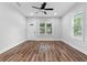 Well-lit living area featuring hardwood floors, white trim, and a welcoming atmosphere at 2209 Browns Mill Se Rd, Atlanta, GA 30315