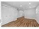 A spacious room with wood-look floors, neutral walls, and closet at 2209 Browns Mill Se Rd, Atlanta, GA 30315