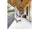 Inviting back porch featuring string lights, comfortable seating, and outdoor ambiance at 2439 Muirfield Pl, Atlanta, GA 30337