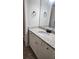 Bathroom vanity with granite countertops, ample storage, and modern fixtures at 2439 Muirfield Pl, Atlanta, GA 30337