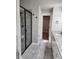 Bathroom showcasing glass shower enclosure, granite counters, and tile floor at 2439 Muirfield Pl, Atlanta, GA 30337