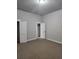 Bedroom with connecting door and closet at 2439 Muirfield Pl, Atlanta, GA 30337