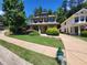 Traditional-style home with well-maintained lawn and a fire hydrant in the foreground at 2439 Muirfield Pl, Atlanta, GA 30337