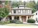 Charming two-story home with a welcoming front porch and manicured landscaping at 2439 Muirfield Pl, Atlanta, GA 30337