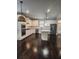 Spacious kitchen with white cabinets, stainless steel appliances, and island, with hardwood floors and a modern design at 2439 Muirfield Pl, Atlanta, GA 30337