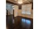 Bright living room featuring dark hardwood floors and recessed lighting at 2439 Muirfield Pl, Atlanta, GA 30337