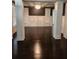 Elegant living room with dark hardwood floors, and stylish architectural details, creating a refined ambiance at 2439 Muirfield Pl, Atlanta, GA 30337