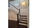 Staircase with dark wood steps and white risers at 2439 Muirfield Pl, Atlanta, GA 30337